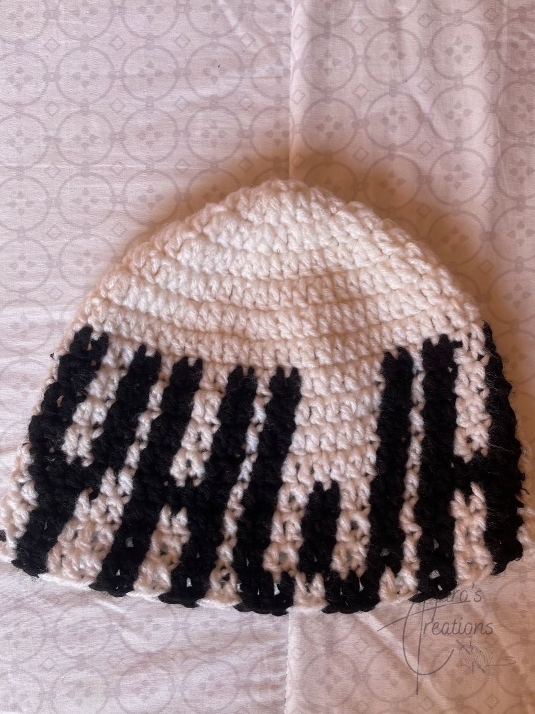 Cream crochet beanie with bold black YAWH lettering